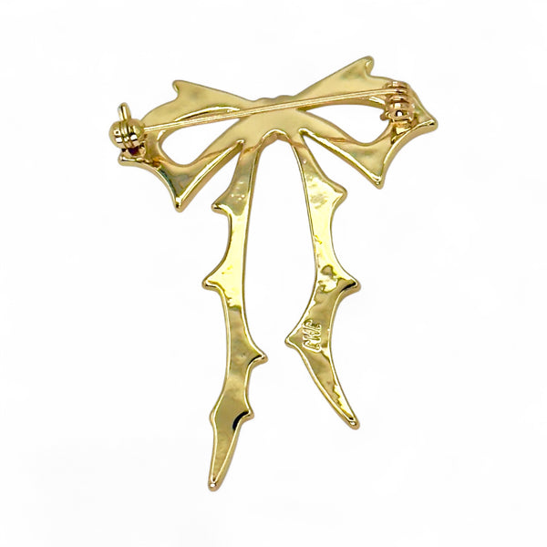 Carrie Bow Brooch in yellow gold with stainless-steel base and gold-filled bow design by Jagged Halo Jewelry.