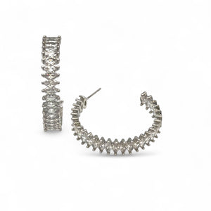 Pair of silver hoop earrings on a white background