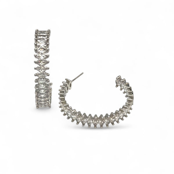 Pair of silver hoop earrings on a white background