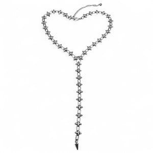 Silver star-shaped necklace on a white background