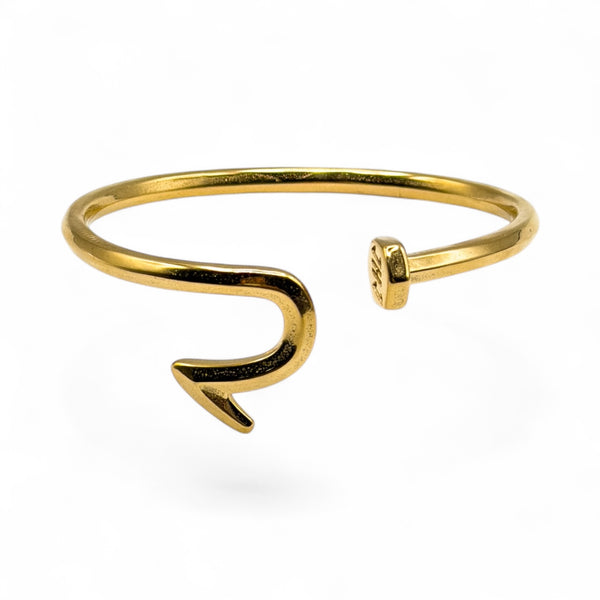 Gold fish hook bracelet on a white background
