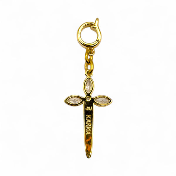 Gold cross-shaped charm with 'Karma' engraving on a white background