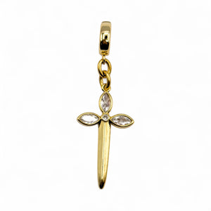 Gold cross-shaped pendant with embedded stones on a white background