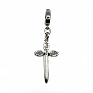 Silver cross pendant charm with embedded stones on a white background