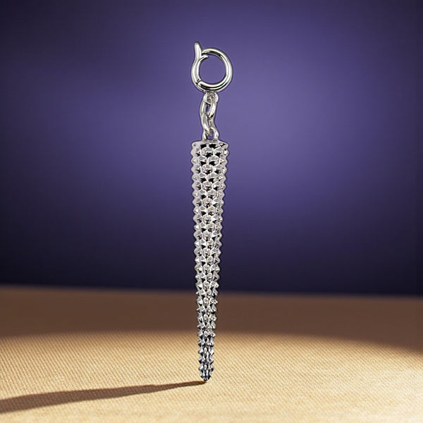 Silver textured pendant on a dark purple background