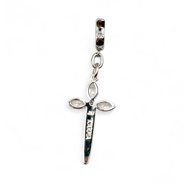 Silver cross pendant charm with clear gemstones on a white background