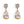 Gold earrings with clear teardrop-shaped gemstones on a white background