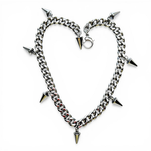 Chain necklace with spike accents on a white background