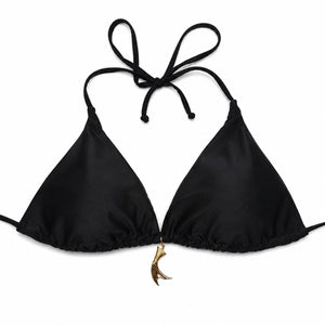 Black bikini top with tie straps and a gold charm on a white background