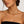 yellow gold plated stainless steel collar necklace choker jagged halo jewelry worn by brunette model wearing black strapless dress