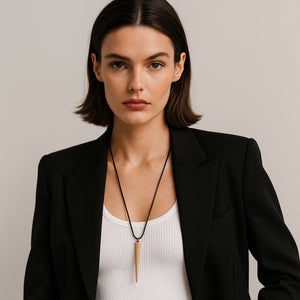 Brunette bob hair cut woman wearing black blazer with white tank top and the benson necklace By jagged halo jewelry 