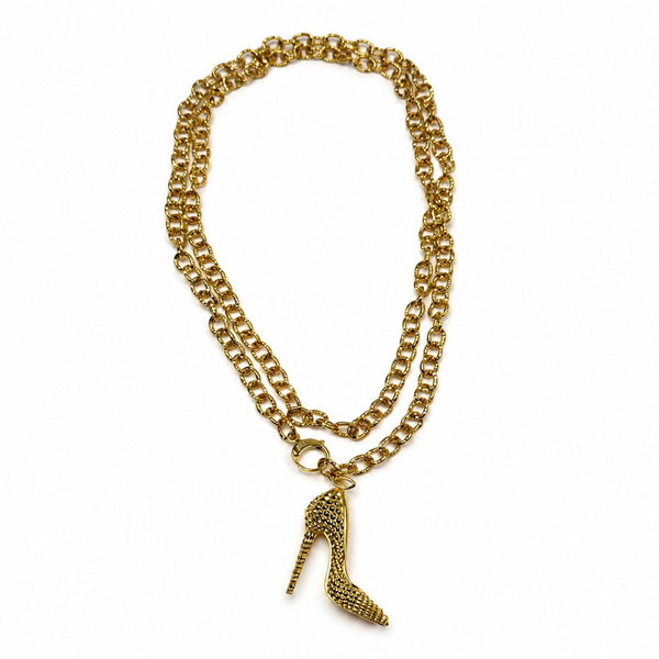 Gold I’M BAD stiletto heel pendant with pyramid-spike texture
