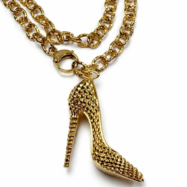 Silver I’M BAD stiletto heel pendant with pyramid-spike texture