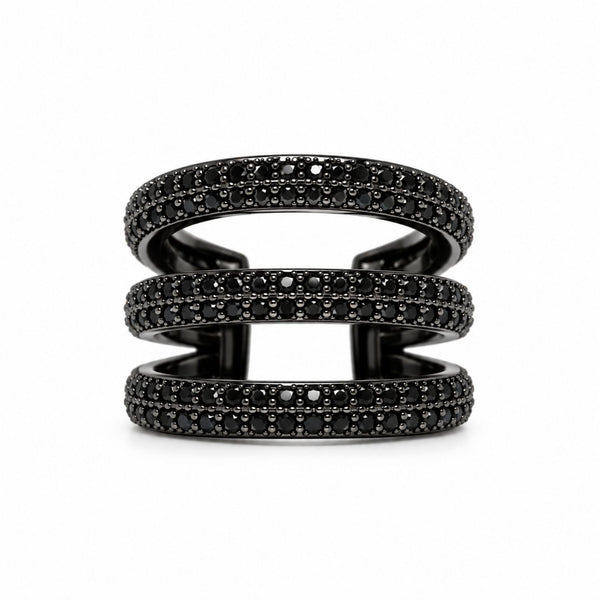 A three-band triple pave ear cuff in black metal, embellished with rows of small black gemstones, shown on a plain white background.