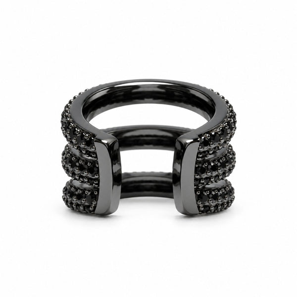 A black triple pave ear cuff featuring textured pavé-set dark stones on its outer bands, photographed on a clean white background.