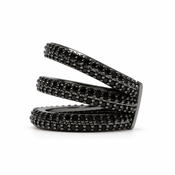 A black triple pave ear cuff featuring multiple horizontal bands encrusted with small round black gemstones, photographed on a clean white background.