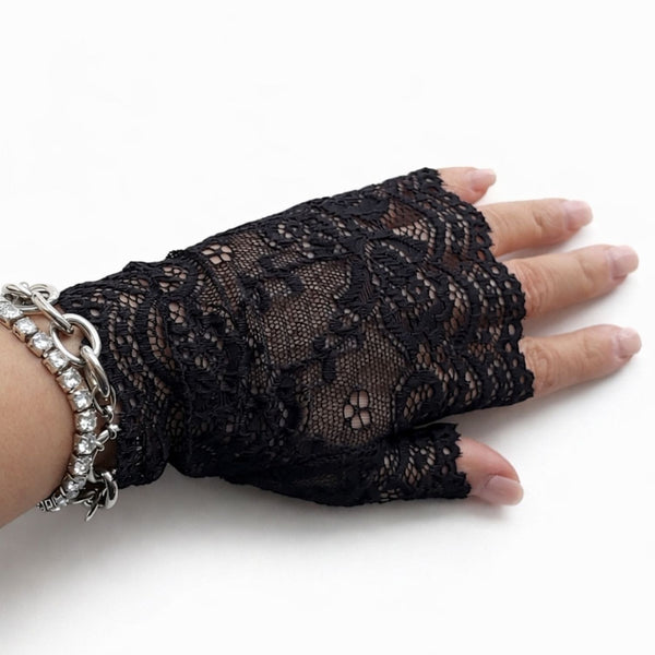 Black lace glove on a hand with a white background by jagged Halo jewelry 