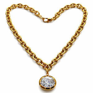 Gold chain necklace with a diamond pendant on a white background