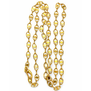 Gold chain necklace on a white background