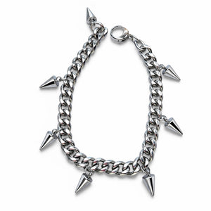 Silver chain bracelet with spike charms on a white background