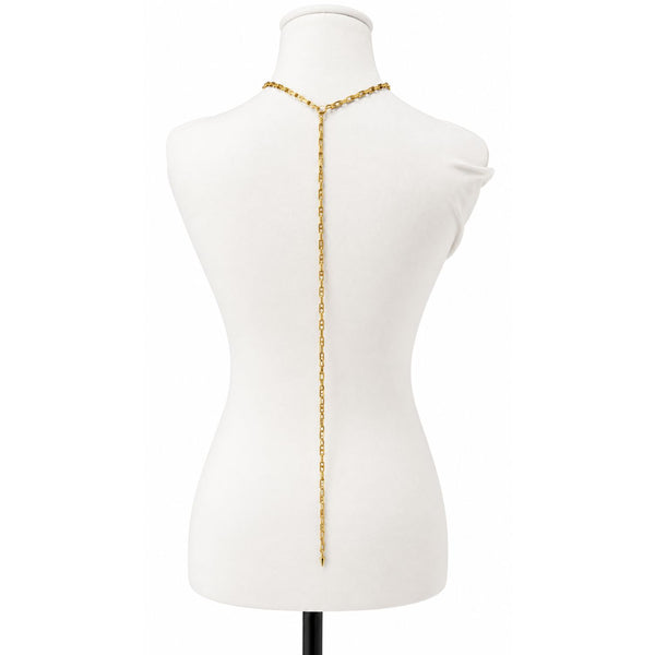 A gold Y-shaped chain necklace displayed on a white mannequin torso, showing the back view with the chain hanging down the center.
