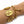 A gold charm bracelet with three religious medallion charms, a high-heeled shoe charm, and a sunburst bird charm, shown worn on a person's wrist against a white background.