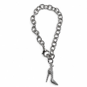 A silver-tone chain bracelet featuring a textured high-heeled shoe charm, displayed on a clean white background.