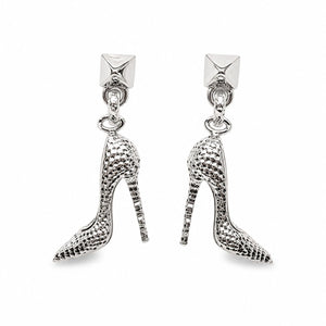 A pair of silver high-heeled shoe drop earrings with a textured, snakeskin-like pattern, featuring a small pyramid stud at the top.