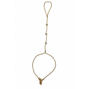 Yellow gold Margot Crystal Hand Chain with three bezel-set CZ stones on a white background