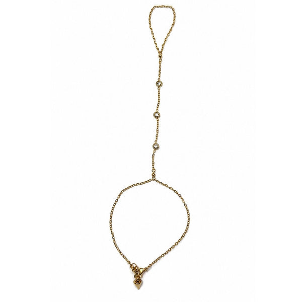 Yellow gold Margot Crystal Hand Chain with three bezel-set CZ stones on a white background