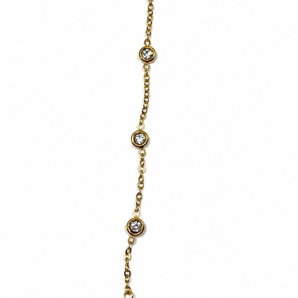 Close-up of yellow gold Margot Crystal Hand Chain with round bezel-set CZ stones