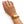 A gold-toned, ribbed wing-shaped cuff bracelet worn on a woman's wrist, shown against a plain white background.