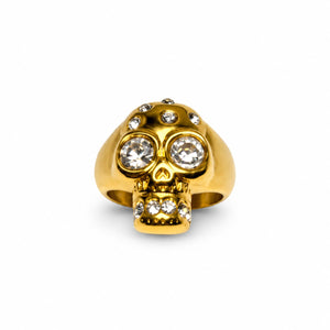 Gold Memento crystal skull ring with clear stone eyes, front view