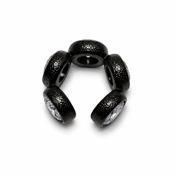 A set of five black textured charm beads with clear faceted rhinestones, arranged in a semi-circle on a white background.