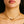 baby bond necklace in yellow gold on white model 