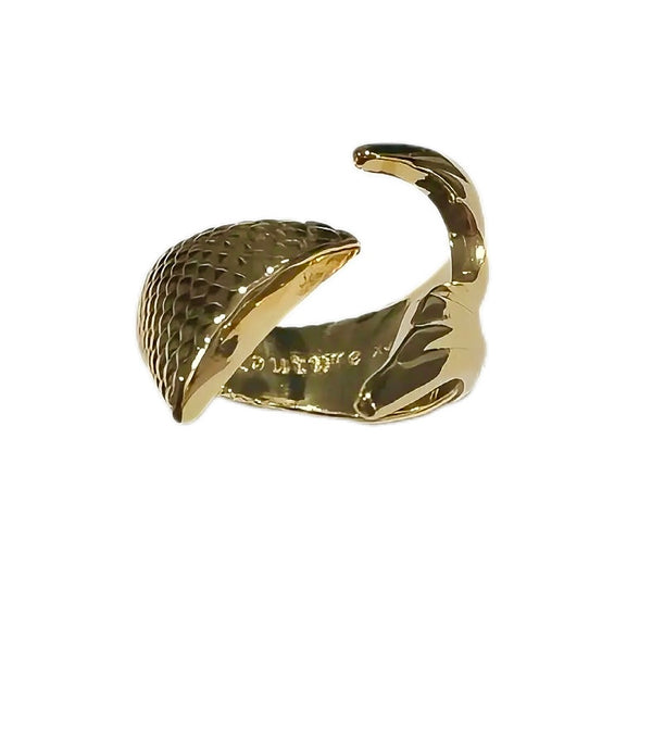 Gold snake-shaped ring on a white background
